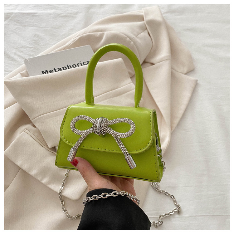 Alta textura estilo Chanel color sólido arco pequeño cuadrado bolso de las mujeres 2023 invierno nueva cadena crossbody del hombro