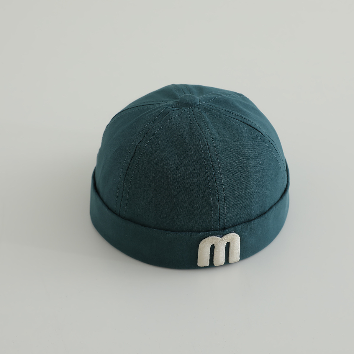 letras coreanas m niños terratenientes sombrero primavera y otoño modelado cóncavo de moda para hombres y mujeres bebés sombrero de tela de color sólido