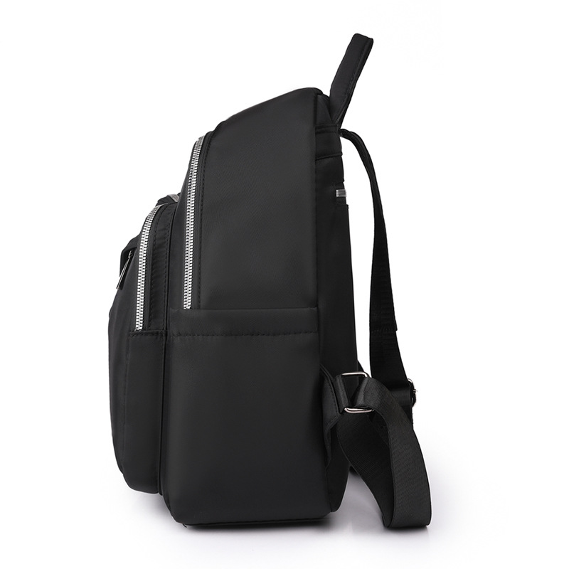 2023 verano nuevo estilo casual color sólido damas mochila de nailon moda salvaje mochila de viaje de gran capacidad al por mayor