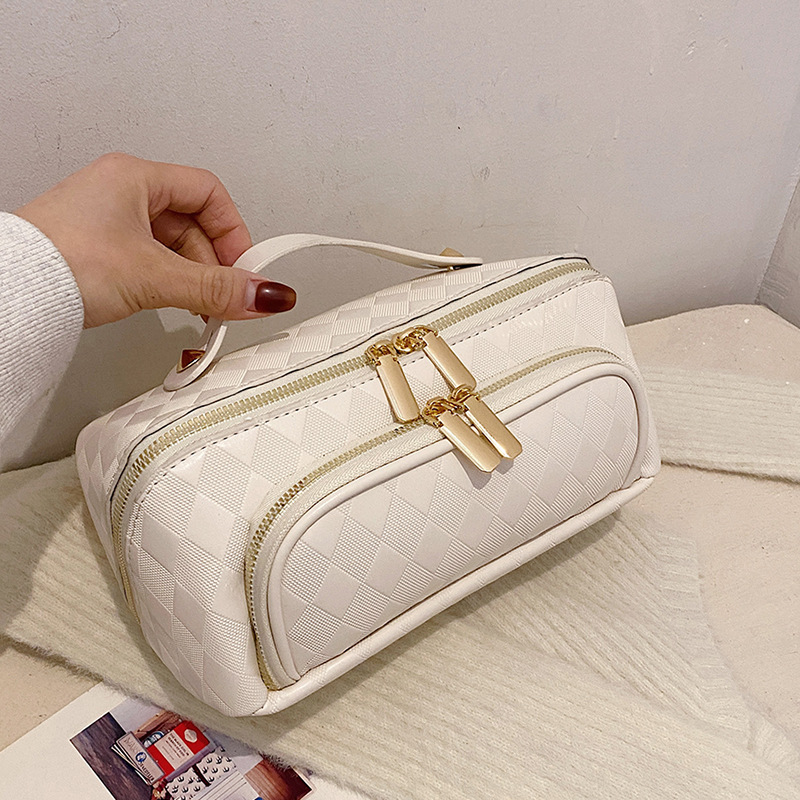 Nuevos bolsos de maquillaje transfronterizos pu-rango de nicho de moda de gran capacidad para mujeres bolsas de almacenamiento portátiles de viajes en línea bolsa de lavado roja