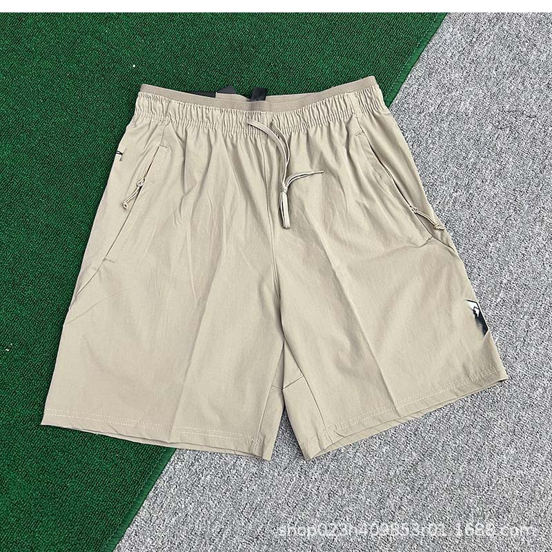 Fabricantes al por mayor de pantalones cortos deportivos para hombres de velocidad de hielo seco maratón de verano delgado entrenamiento de acondicionamiento físico pantalones de moda