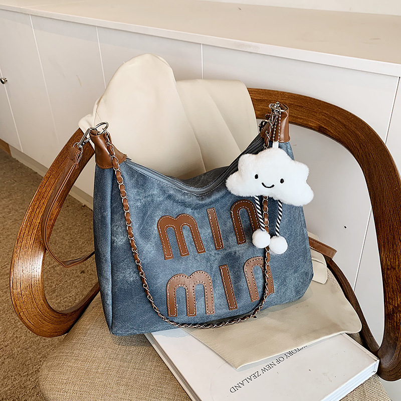 Bolsa de hombro coreana retro para mujeres otoño / invierno 2024 nuevo bolso de brazo de moda casual portátil personalidad textura mochila