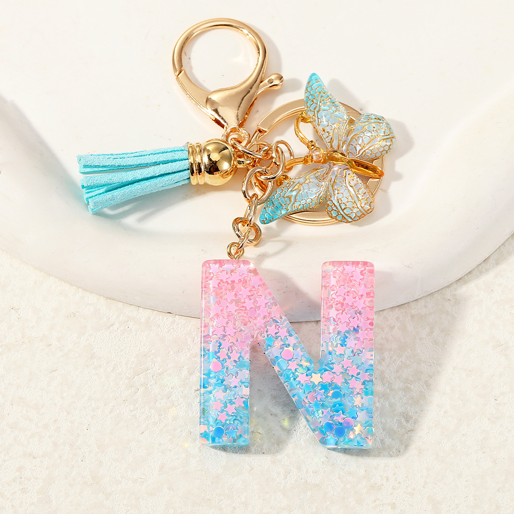 Europa y los Estados Unidos transfronterizos nuevos cristal sequinado goteo de goma letras inglesas joyería llavero y bolsos colgante apoyo al por mayor