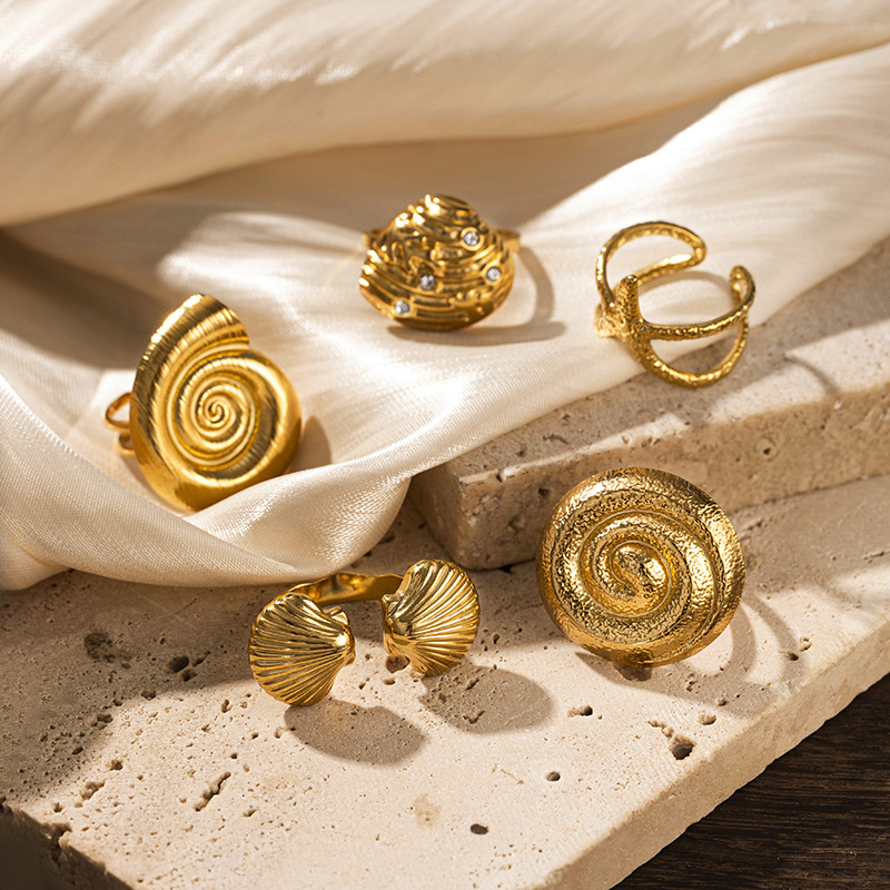 Anillo de acero inoxidable de oro de 18 quilates de TINA nicho de diseño de vacaciones marinas anillo de acero de titanio no se desvanece joyería