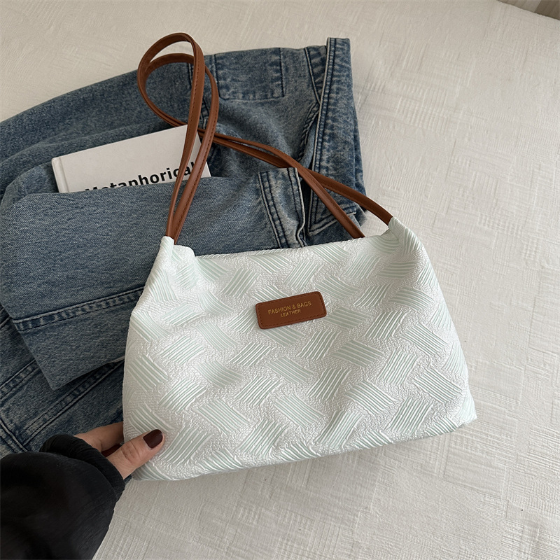 Nicho de diseño bolso de diamante para mujeres 2024 nuevo estilo de alta calidad sensación de gran capacidad portátil de viaje a mano rayas de hombro bolso