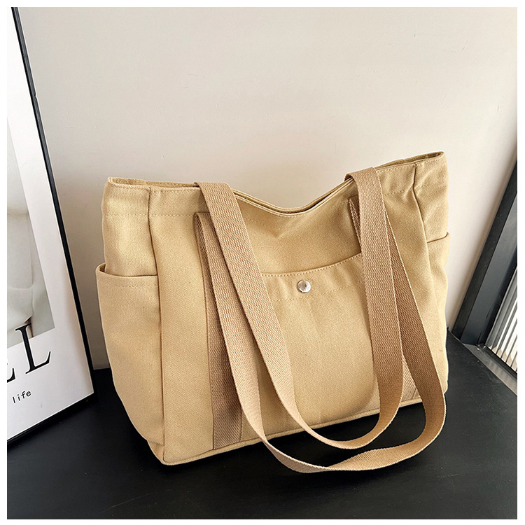 Wholesale of new women's single-shoulder bags, cross-border simple and casual canvas bags, Korean version LOGO printed commuter tote bags undefined