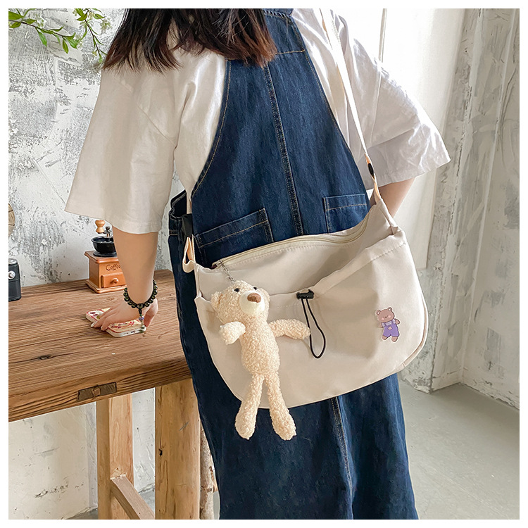 The new 2022 Little Bear canvas small bag for women is simple and versatile. The student dumpling bag is a trendy casual single-shoulder crossbody bag undefined