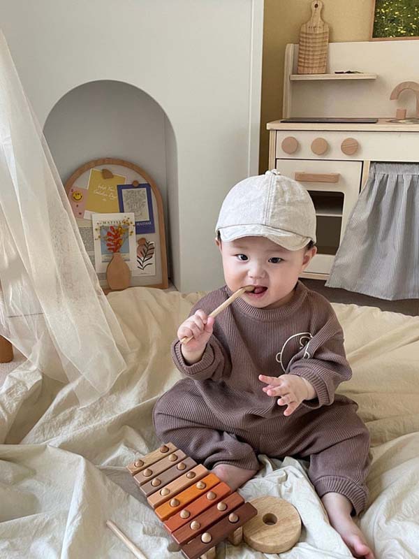 Vêtements pour enfants coréens bébé trésor automne nouveau graffiti dessin animé tête humaine pull pantalon ensemble deux pièces_voghion.com