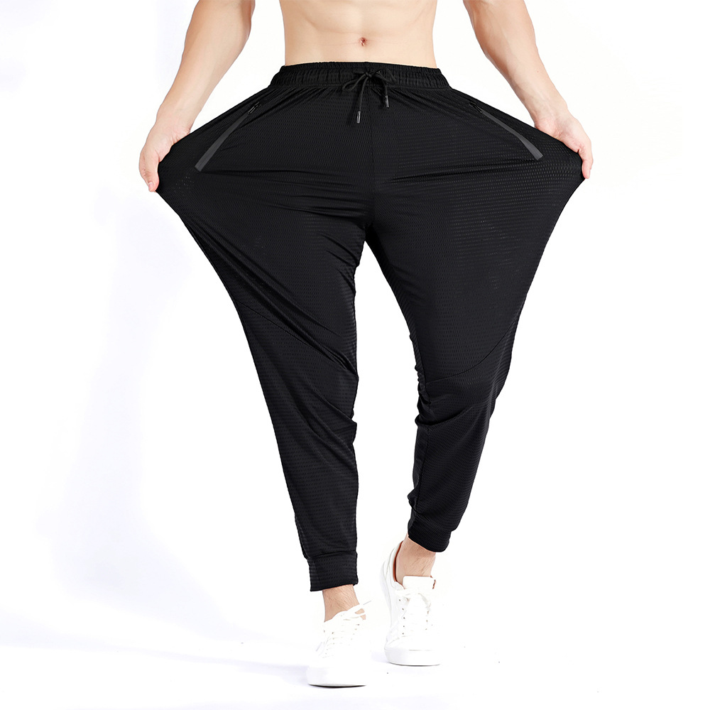 Pantalones deportivos de otoño sueltos más el tamaño de los hombres pantalones elásticos de entrenamiento de secado rápido pantalones ajustados de seda de hielo transpirable en stock