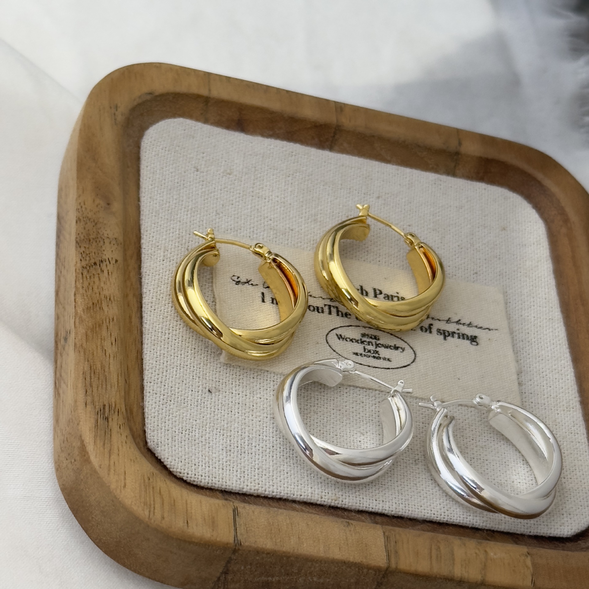 Fashionable C-Shaped Twisted Metal Minimalist Earrings with a High-End European and American Style, Featuring Cross Hollow Design and Circular Shape