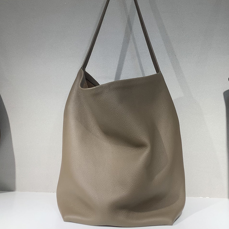 本革レディースバッグ、第一層牛革、都会的でシンプルな大容量バケットバッグ、トーゴ高級バッグ革メーカー卸売