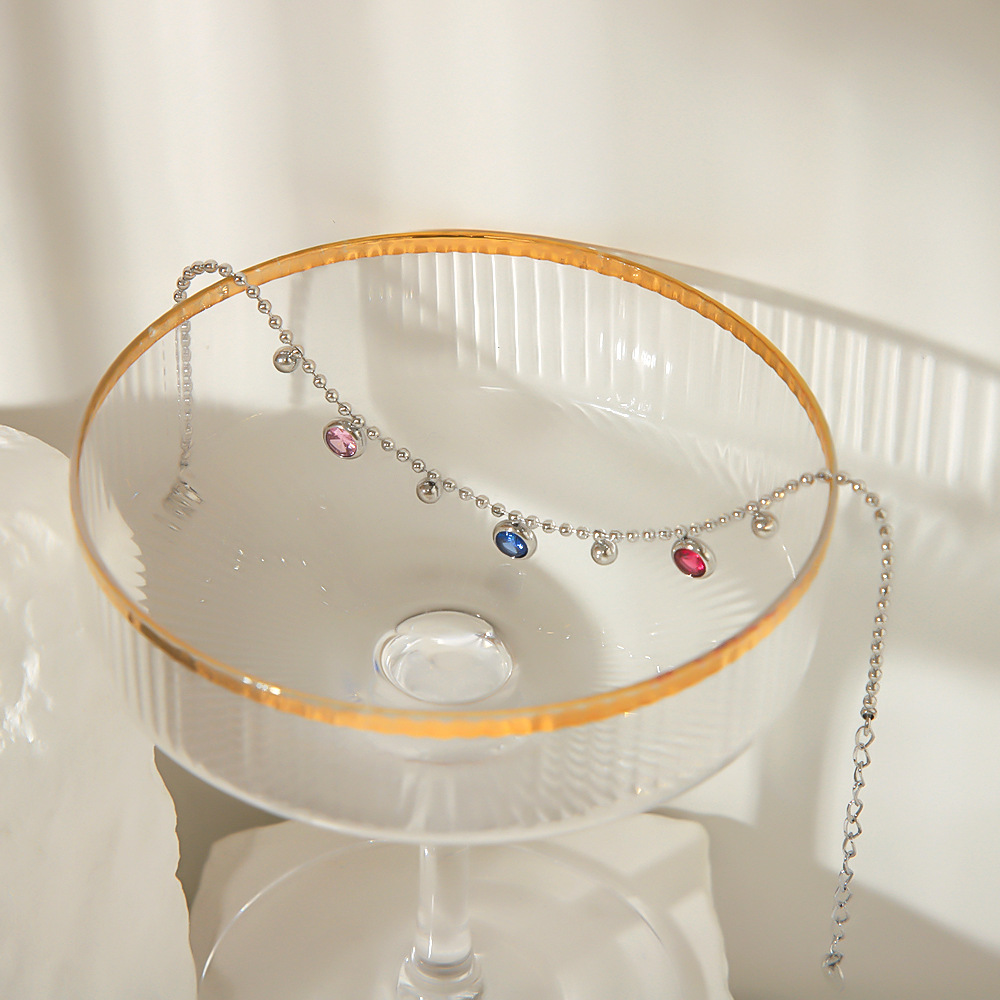 2024 nuevo estilo europeo y americano transfronterizo retro acero inoxidable color diamante redondo pequeña cuenta redonda borla colgante titanio acero tobillera mujer