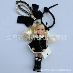 キーホルダーのアクセサリーは子供を包んで卸売りします。