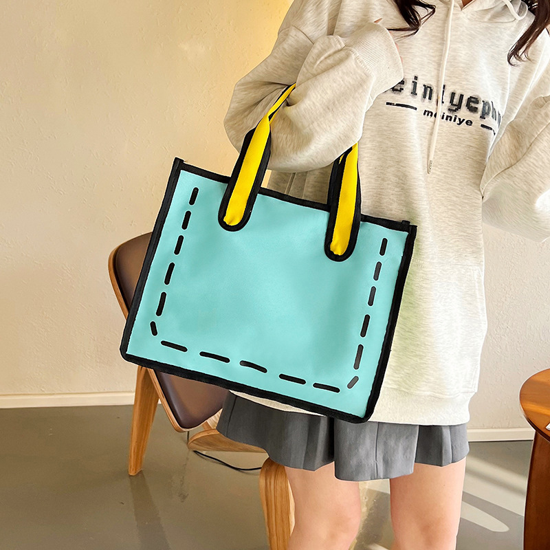 2023 nuevo bolso de lona de niña japonesa de dibujos animados bidimensional para mujer bolso de compras portátil a juego de color bolso de hombro de gran capacidad