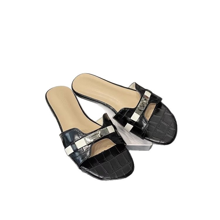 Pequeño botón de oro cocodrilo patrón de dedos franceses zapatillas de fondo plano para mujeres 2026 nuevas zapatillas frías de playa de arena suave