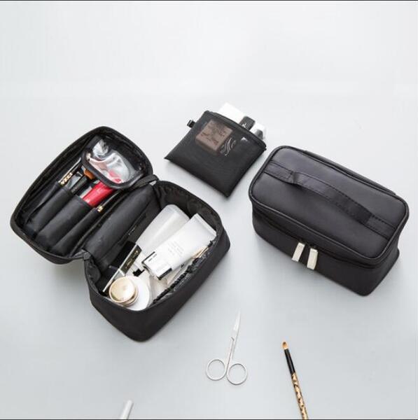 Capacious handheld cosmetic bag