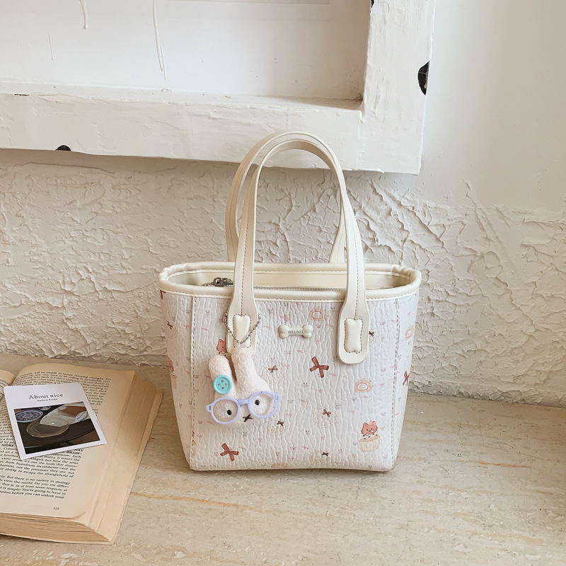 Fresco dulce popular impresión bolsos personalidad extranjera versátil bolsos de mochila de moda diaria bolsos de cubo portátiles