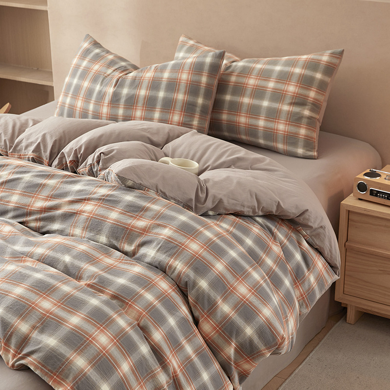 Nuevo traje de cama de algodón lavado de algodón de cuatro piezas de algodón 2025 nuevo traje de dormitorio de funda de edredón de sábana simple de tres piezas