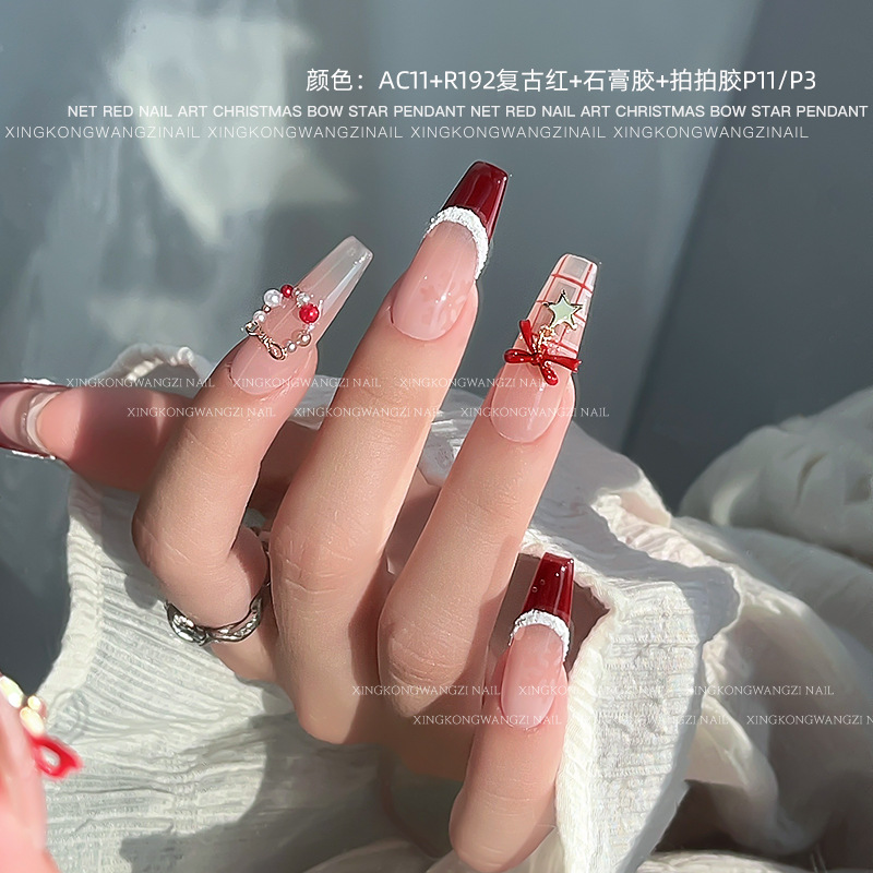 Navidad arco joyas de manicura otoño y invierno nuevo tipo de alta protección de color pentagonal aleación colgante tridimensional accesorios de uñas
