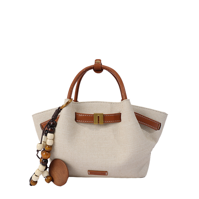 Nicho coreano bolsas de mano tote mujeres 2026 comercio exterior nuevo relajado sensación universal hombro mochila canasta de verduras