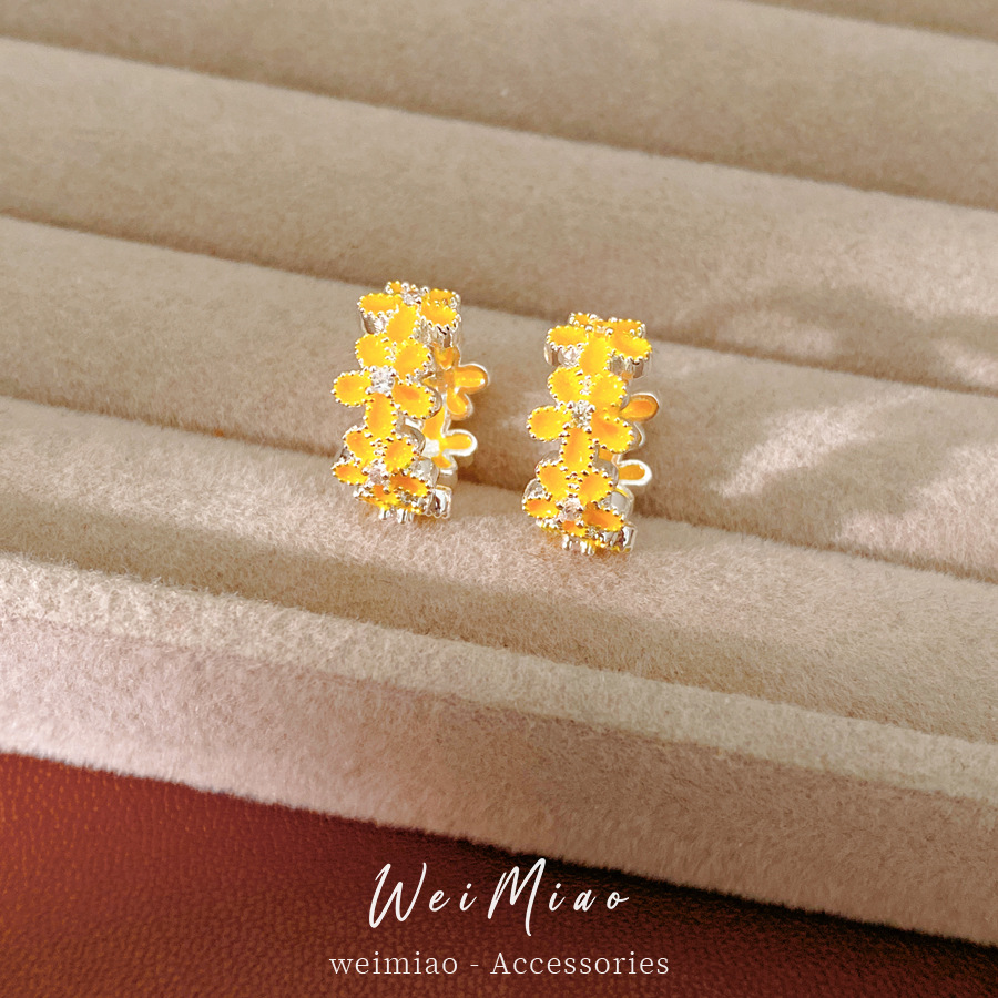 Dopamina color zircón goteo flor aretes redondos frescos aretes dulces lujosos alta sensación auriculares al por mayor