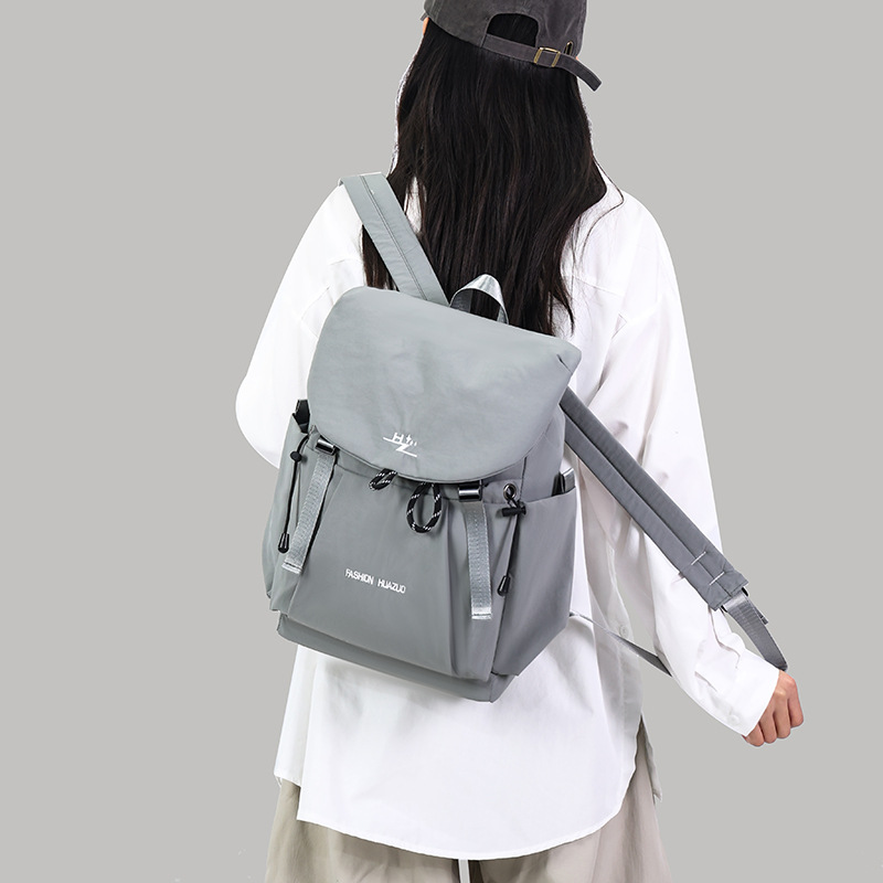 Al por mayor transfronterizo nueva mochila de estudiantes de secundaria a prueba de salpicaduras, mochila de estudiantes de secundaria ligera, mochila de gran capacidad