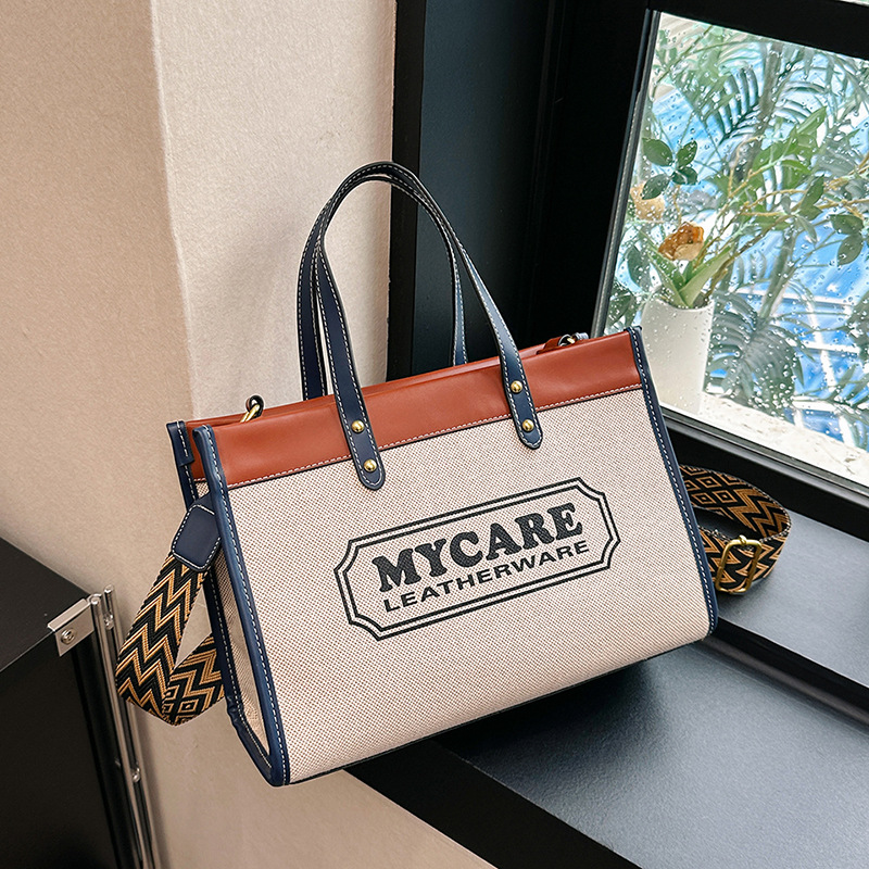 Bolso tote de gran capacidad, bolso de mano para clase y viajes, el popular bolso bandolera con estampado de letras de moda de este año.