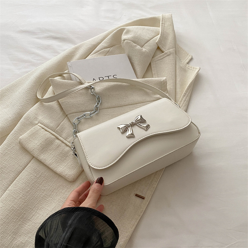 Este año popular bolso de arco para mujeres 2024 nuevo estilo extranjero primavera y verano mini bolso de cadena bolso de mochila