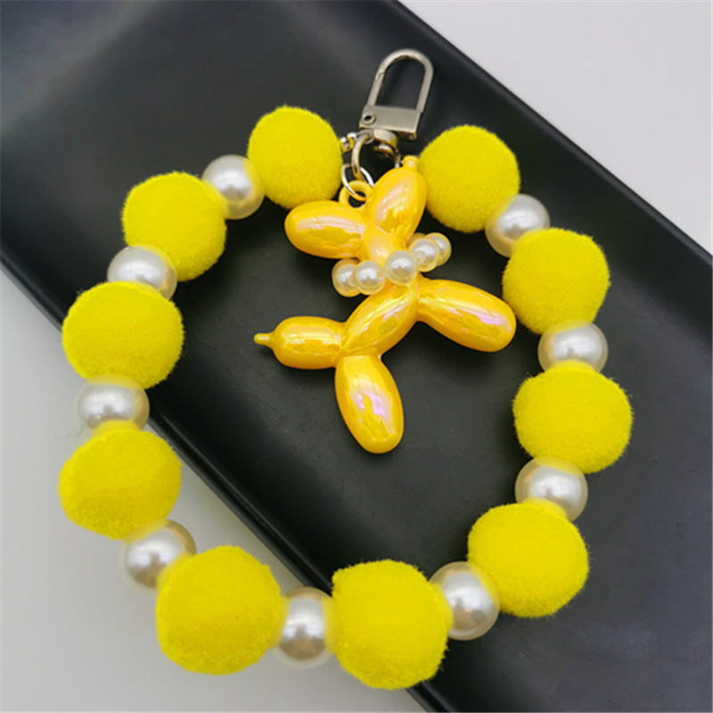 Nueva bola de piel de cadena de perlas colgante cadena de teléfono móvil ins Internet celebridad mismo estilo muñeca de invierno pulsera peluda cadena portátil
