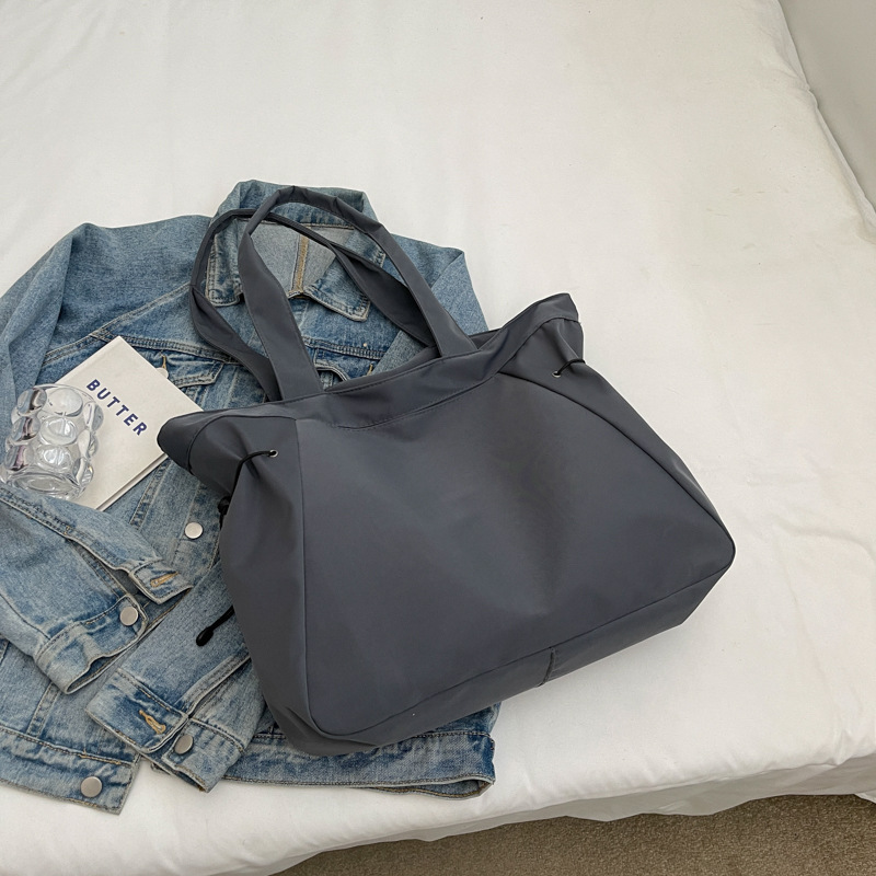 Bolso casual coreano de moda de gran capacidad de color puro 2024 primavera nuevo bolso de axila de un solo hombro ins de todo fósforo