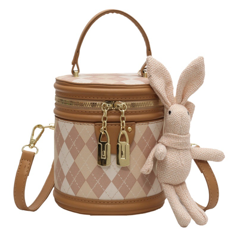 Bolsa de cilindro de rombo simple bolsa de mujer 2024 nueva moda de verano bolsa de mensajero casual popular bolsa de cubo portátil para mujeres