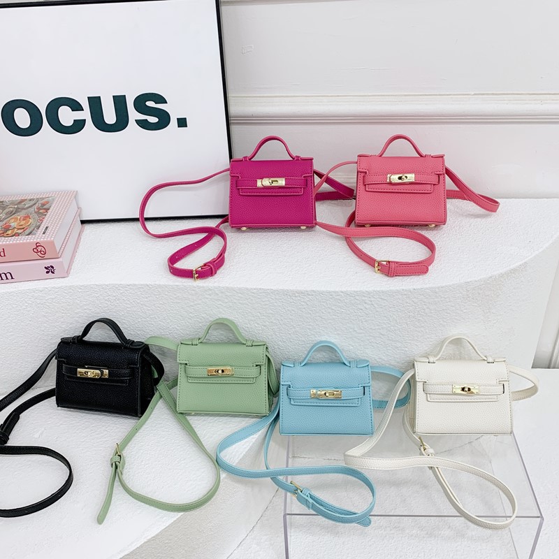 Bolso de hombro para niños y niñas de estilo coreano mini bolso de mensajero para padres e hijos de color sólido simple nuevo monedero con cerradura para niños
