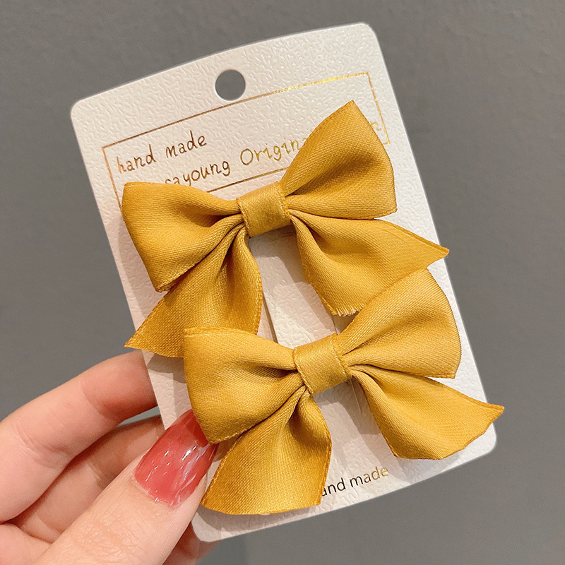 Girl'S Sweet Korean Style Bow Knot Cloth Metal Hair Clip display picture 5