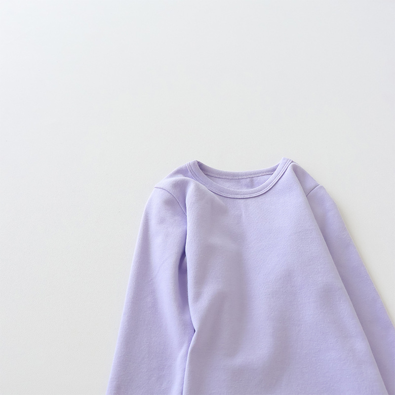 Camiseta de manga larga de algodón puro para niños 2026, camiseta básica para primavera y otoño, top cepillado de cuello redondo de color liso y corte holgado para niños y niñas.