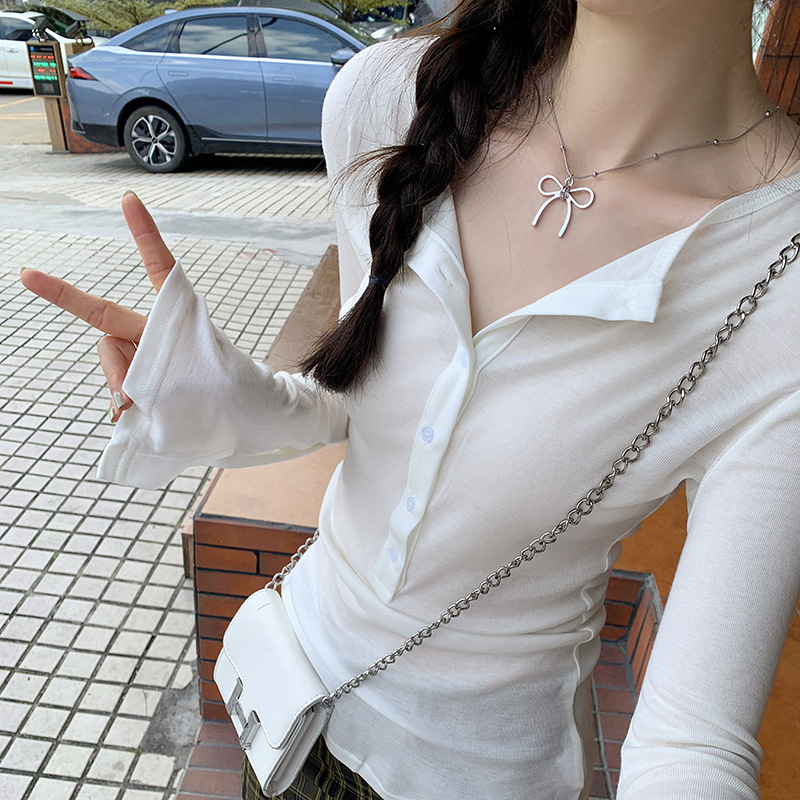 European-Style In-Stock Korean Fashion 2026 Model Versatile Solid Color Button Flare Design Niche Simple Versatile Long-Sleeve T-Shirt European-Style In-Stock Korean Fashion 2026 Model Versatile Solid Color Button Flare Design Niche Simple Versatile Long-Sleeve T-Shirt