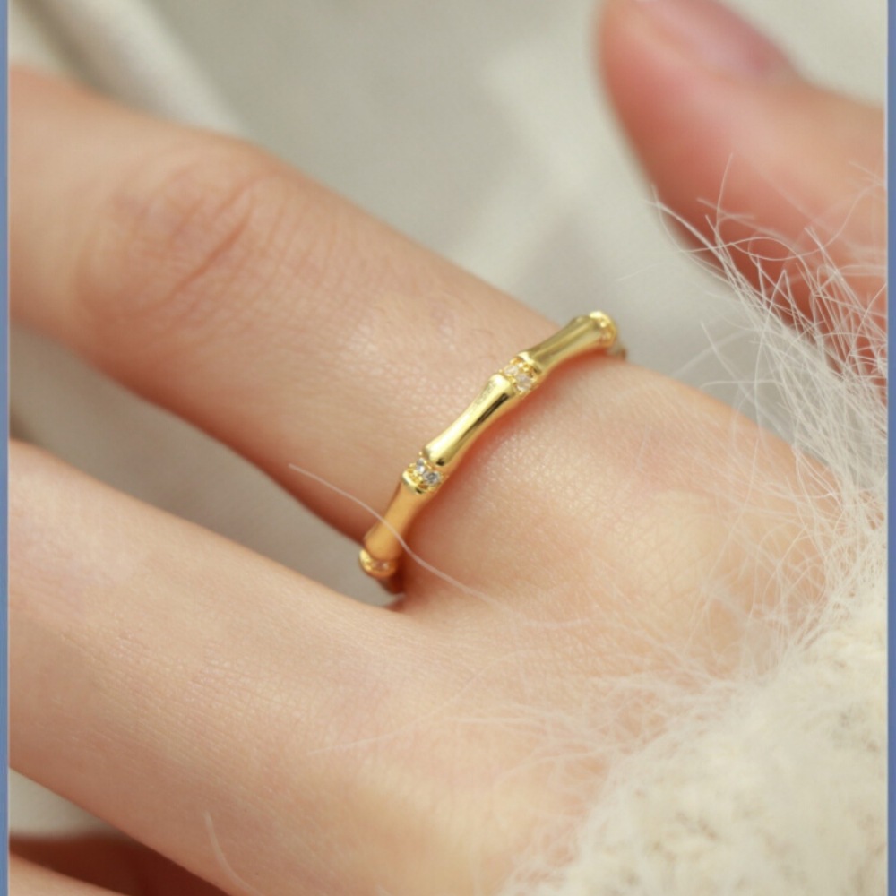 Simple, versatile bamboo-section zircon ring in gold—elegant, adjustable, and uniquely designed for a high-end, trendy look.