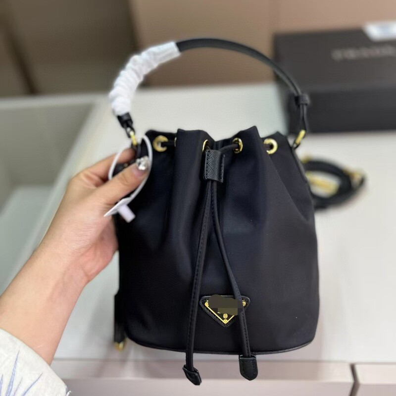 High-End Version of the New Fashion Bucket Mini Bag from P Brand, Made of Parachute Nylon, Can Be Used as a Shoulder Bag, Handbag, or Crossbody Bag High-End Version of the New Fashion Bucket Mini Bag from P Brand, Made of Parachute Nylon, Can Be Used as a Shoulder Bag, Handbag, or Crossbody Bag
