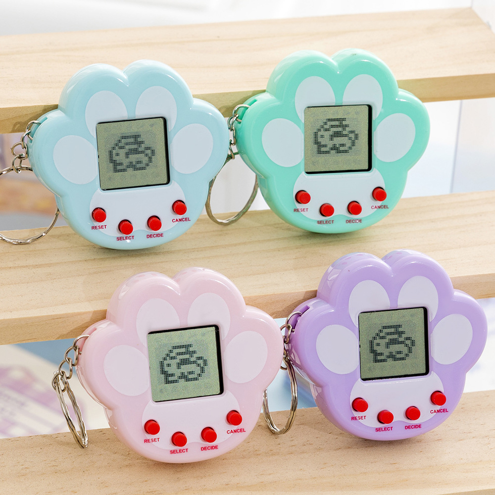 Mini máquina electrónica para mascotas de mano transfronteriza, máquina de juego de desarrollo de mascotas virtual, nuevo juguete electrónico de garras de gato extraño