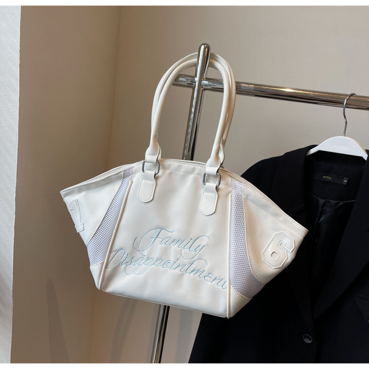 Corea del Sur Dongdaemun moda hombro único brazo bolso mujer 202 nuevo bordado de tela transfronterizo gran capacidad bolso tote