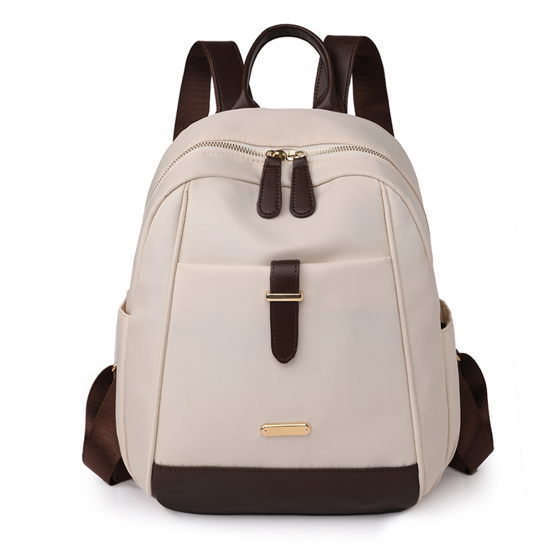 Spot al por mayor 2023 nueva mochila de nailon para mujer coreana moda contraste color al aire libre mochila de viaje portátil marea