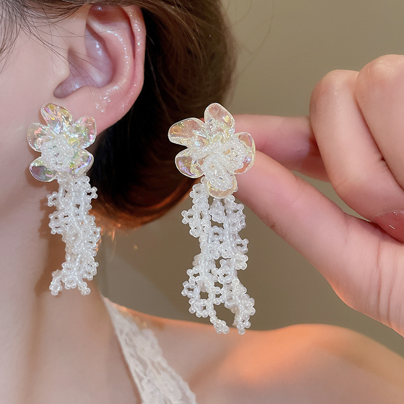 Pendientes de flor de lazo elegante de súper hada de plata Pendientes de moda de lujo ligero francés Pendientes de todo fósforo dulce de estilo literario