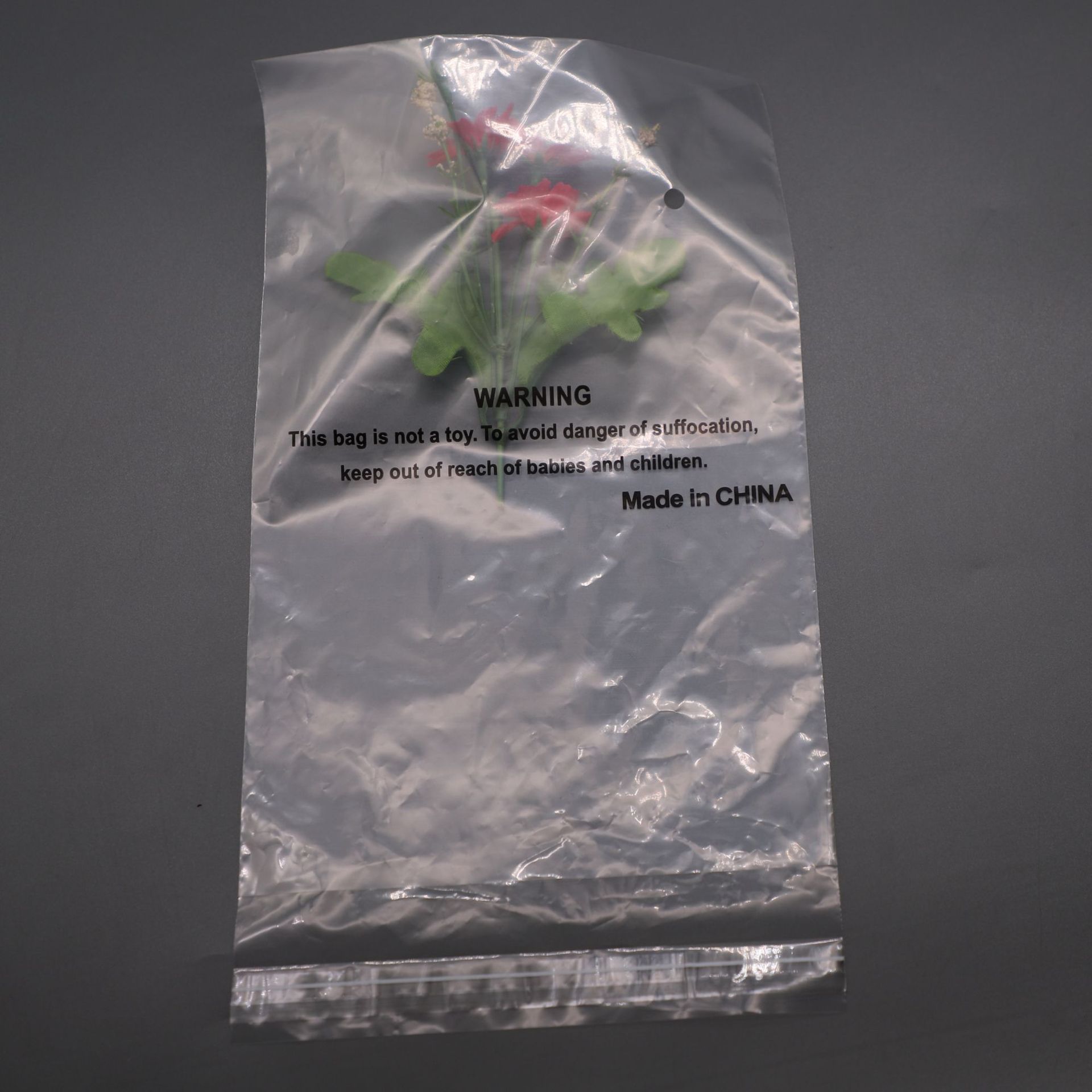 现货外贸出口宠物玩具PE包装袋22*27透明印刷警告语防窒息塑料袋