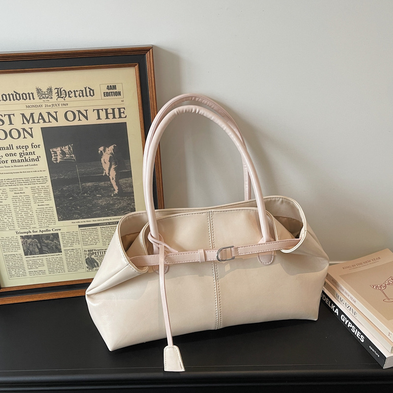 Bolsos de tendencia diaria coreana 2026 primavera nueva moda simple gran capacidad bolso de hombro bolso especial