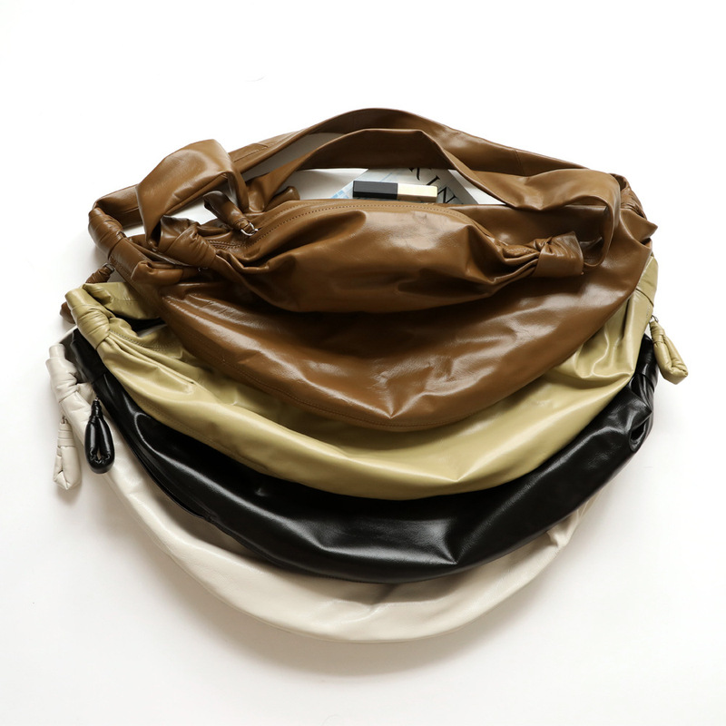 The first layer cowhide croissant bag pleated paper feeling croissant bag messenger bag neutral simple designer women's bag men's bag