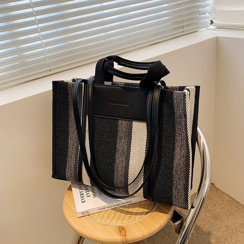 Bolso de mujer nueva línea transfronteriza lienzo color contraste bolso de mano rayas nicho de moda alta moda bolso de hombro