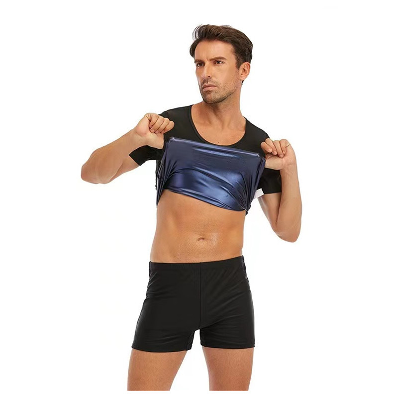 欧米の男性が汗をかく服を着て体を作って腹を収めて運動します。|undefined