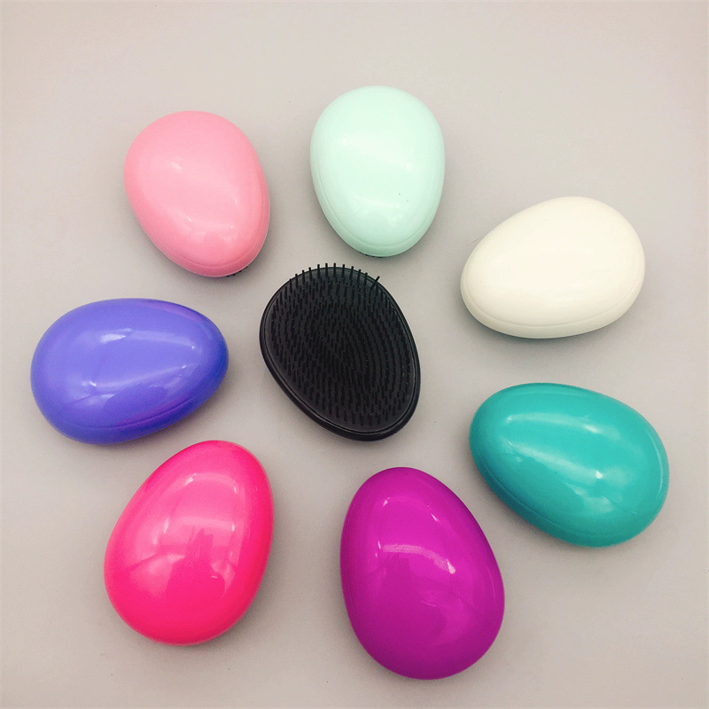 Yangzi fábrica venta al por mayor en forma de corazón belleza peine del pelo masaje peine del pelo mojado y seco de doble uso peine del pelo cáscara de huevo peine de tt mágico