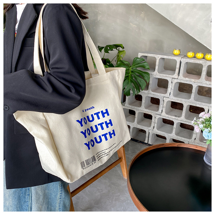 A large-capacity, sturdy Japanese-style canvas bag for women, a new 2022 simple bento handbag for girls to go to work undefined