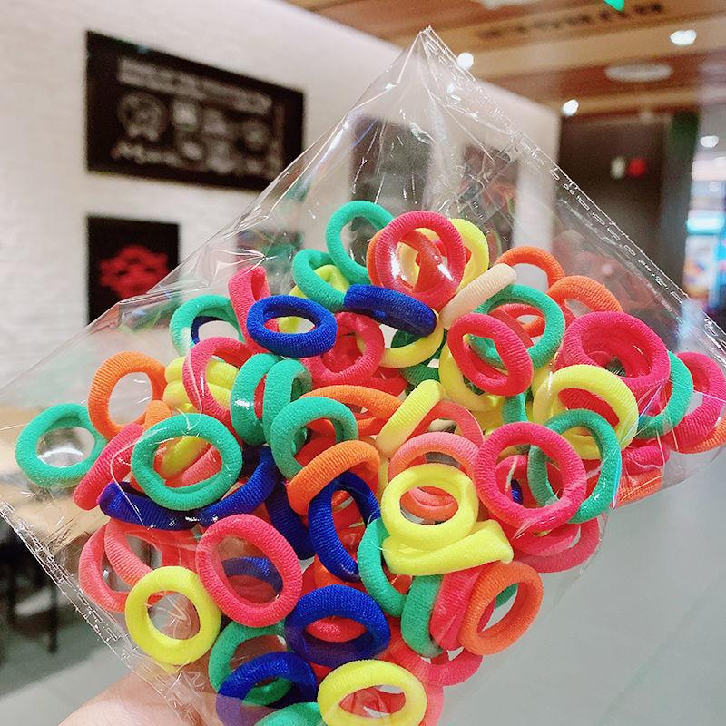 Banda de goma de bebé Corea del Sur banda de pelo de los niños anillo de toalla de color caramelo bolsa de Margarita banda de pelo OPP bolsa cuerda de pelo banda de goma al por mayor