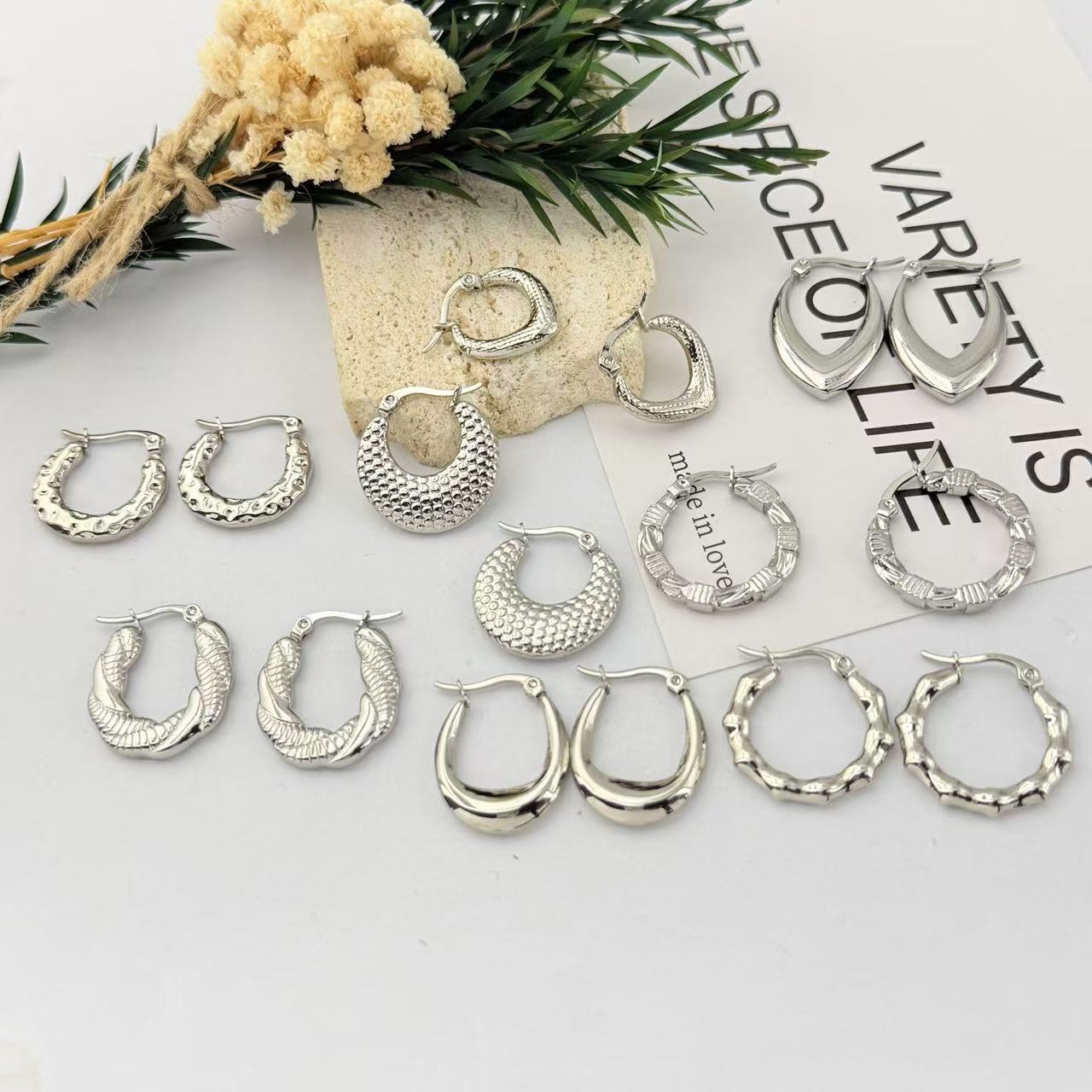 Brand universal earrings for men and women with pigtail stainless…